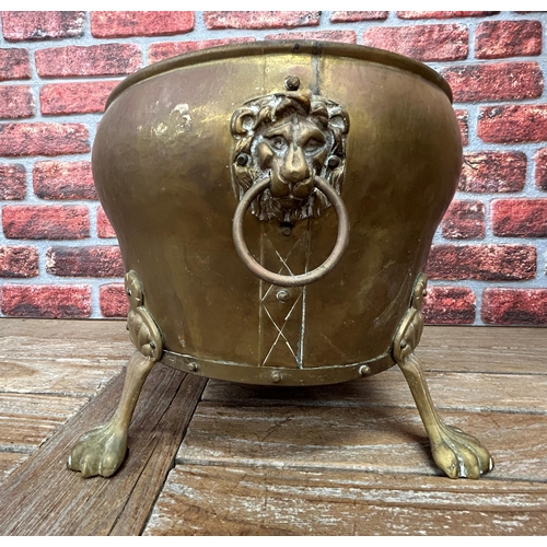 499 - Impressive copper and brass Victorian coal bucket, having lion paw feet and twin handled lion head h... 