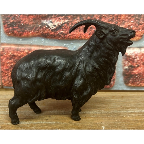 505 - Antique Japanese bronze figure of mountain goat, indistinct calligraphy mark to torso, 15cm x 12cm