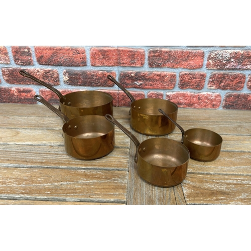 509 - Antique graduating copper saucepans (5)