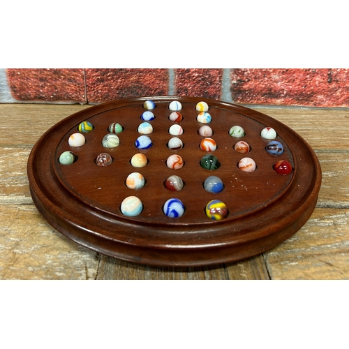 248 - Vintage wooden Solitaire game with assortment of multi coloured marbles