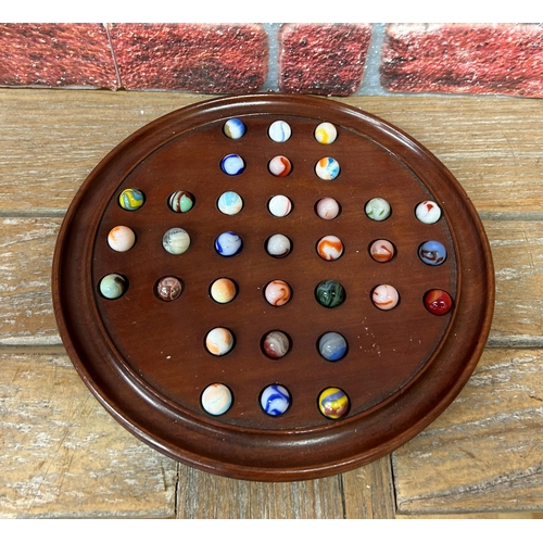 248 - Vintage wooden Solitaire game with assortment of multi coloured marbles