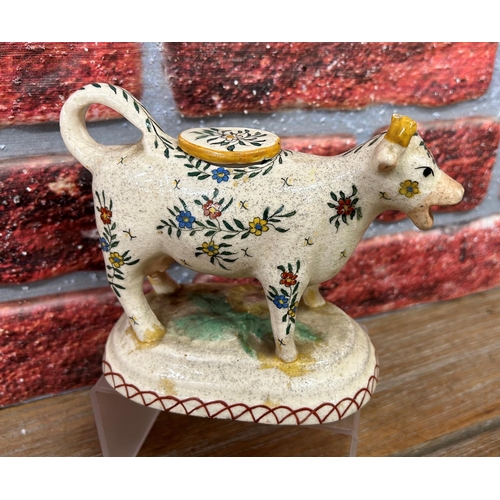 457 - Quantity of antique Staffordshire cow creamers to include floral and Old Willow examples with an add... 