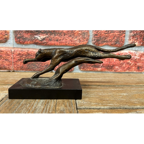 511 - Running cheatah bronze figure, in the style of Dylan Lewis, stamped to base, held atop wooden plinth... 