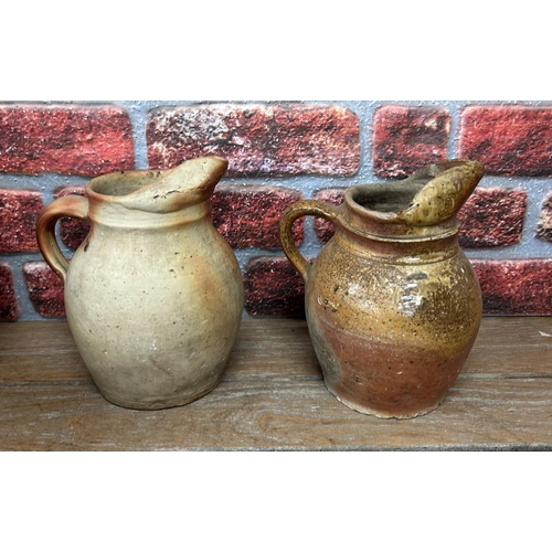 460 - Quantity of antique brown salt glazed earthenware jugs and pitchers, largest H 38cm (6)