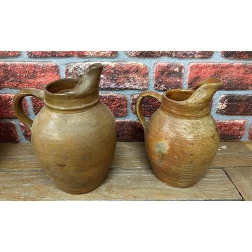 460 - Quantity of antique brown salt glazed earthenware jugs and pitchers, largest H 38cm (6)