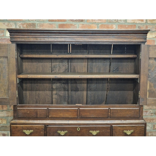 1191 - Georgian oak livery cupboard, the upper section enclosed by two fielded cupboard doors, above the ba... 