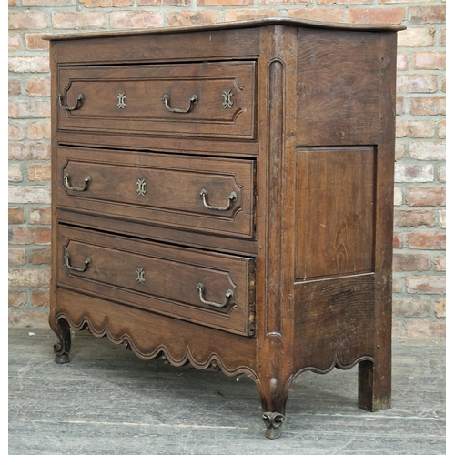 1202 - An early 19th century French provincial oak commode chest of four drawers, H 122cm x W 132cm x D 52c... 