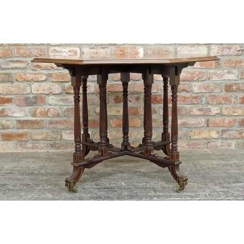 1228 - 19th century mahogany and satinwood inlaid octagonal centre table in the Gillows style, raised on br... 