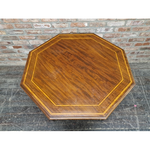 1228 - 19th century mahogany and satinwood inlaid octagonal centre table in the Gillows style, raised on br... 