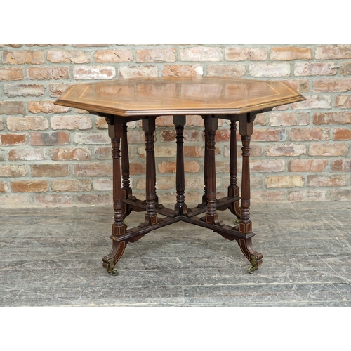 1228 - 19th century mahogany and satinwood inlaid octagonal centre table in the Gillows style, raised on br... 