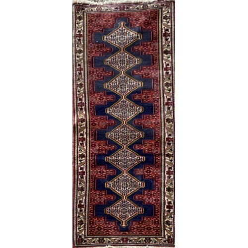 1584 - Persian runner with repeating medallion decoration, blue ground, 230cm x 76cm