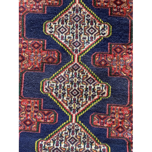 1584 - Persian runner with repeating medallion decoration, blue ground, 230cm x 76cm