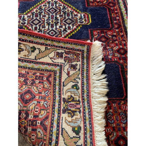 1584 - Persian runner with repeating medallion decoration, blue ground, 230cm x 76cm