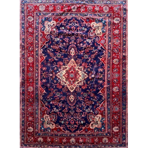 1619 - Large Hamadan carpet, intricate decoration on blue ground, 318cm x 215cm