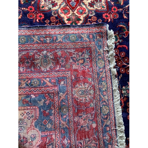 1619 - Large Hamadan carpet, intricate decoration on blue ground, 318cm x 215cm