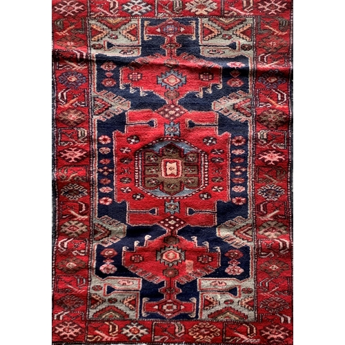 1622 - Full pile Persian village rug, red ground, 185cm x 120cm