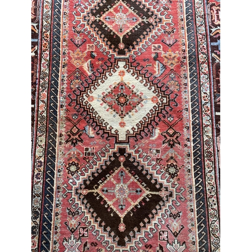 1625 - Good Persian Village rug, diaper panel decoration, 285cm x 155cm