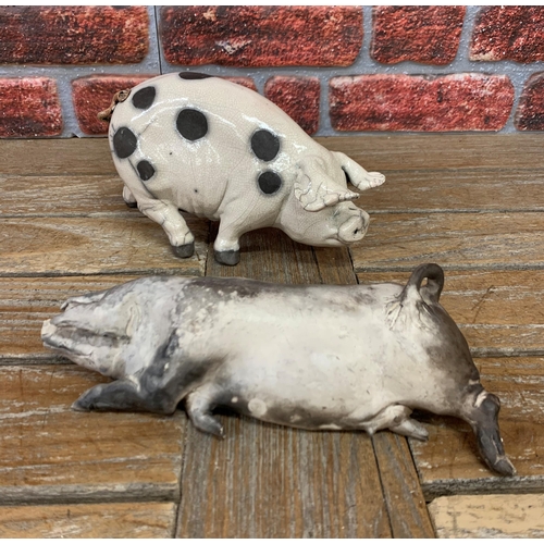 466 - Raku pottery spotted pig with further 'Dring Sow' example, both signed to base, largest L 25cm