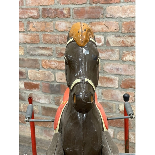 605 - Metal suspended rocking horse, painted horse on sprung frame, L 100cm x W 53cm x H 92cm