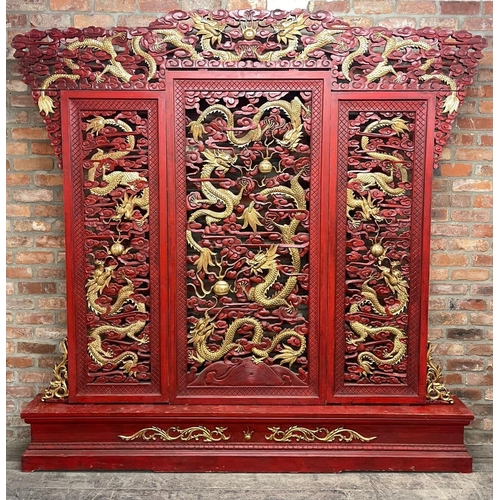 1240 - Large ornate Chinese cinnabar type red lacquered screen, pierced with gilt pearl chasing dragons, L ... 