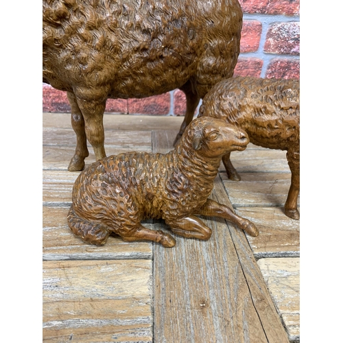 550 - Bavarian 19th century fine naturalistic carved Black Forest graduated trio of pine sheep,  largest h... 