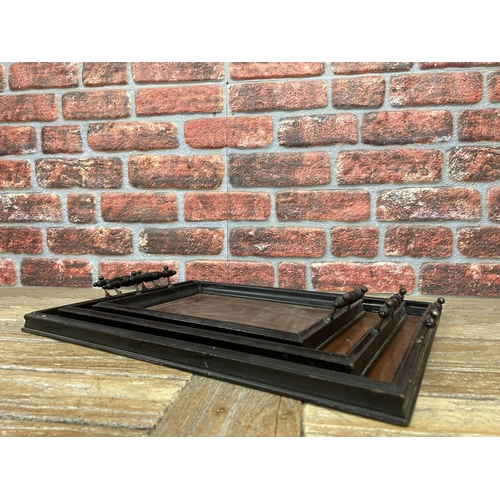 546 - Graduating set of Aesthetic movement ebonised twin handled serving trays, largest 59cm x 42cm (3)