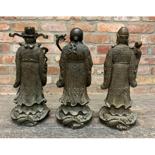 394 - Three impressive Chinese bronze Sanxing Deity immortal figures atop dragons, Lu Xing, Fu Xing and Sh... 