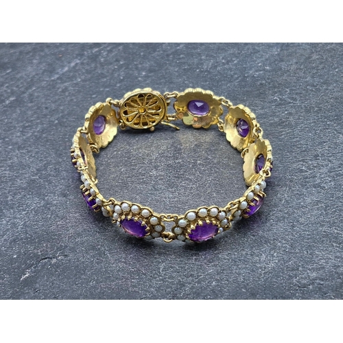 45 - Victorian style 9ct amethyst and seed pearl panel bracelet, fitted with ten amethysts each framed wi... 