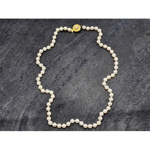 46 - Good string of pearls possibly by Mikimoto with 18ct floral clasp, 47.5cm long, 21.6g gross, in orig... 