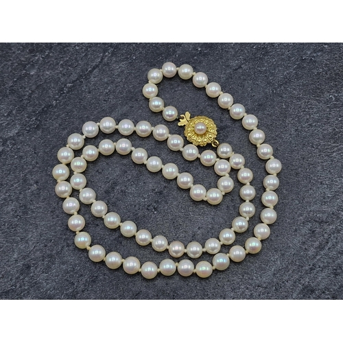 46 - Good string of pearls possibly by Mikimoto with 18ct floral clasp, 47.5cm long, 21.6g gross, in orig... 