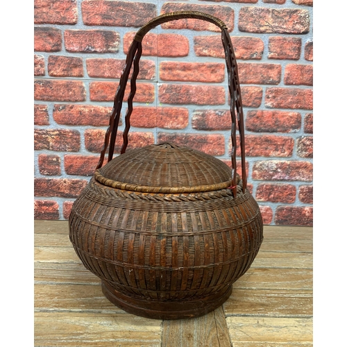 395 - Two vintage hand woven Oriental baskets with additional collection tray, largest H 60cm