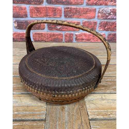 395 - Two vintage hand woven Oriental baskets with additional collection tray, largest H 60cm