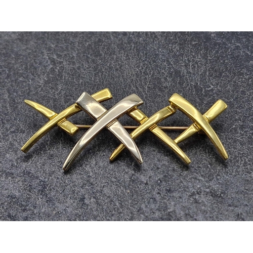 76 - In the manner of Tiffany -Good bi colour 'X'  bar brooch, 6cm long, 11.2g