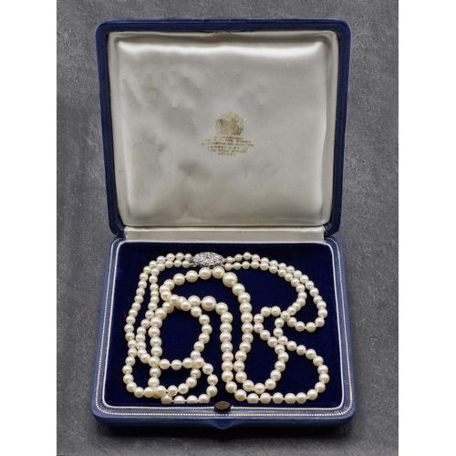 77 - Mid 20th century graduated double row pearl necklace with good diamond and platinum clasp, the clasp... 