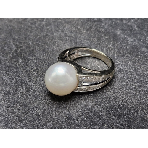 80 - 18ct white gold, pearl and diamond dress ring, large Southsea pearl with 24 round brilliant cut diam... 