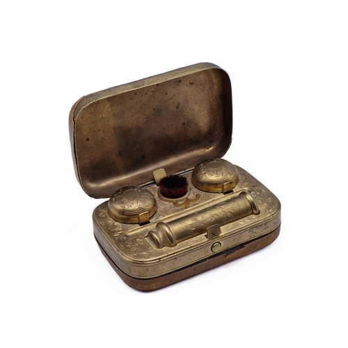 254 - Victorian leather and brass travel inkwell, interior having ornate scrolling throughout with inkwell... 