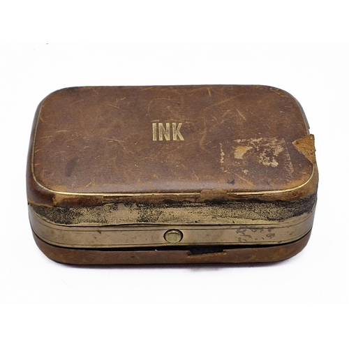 254 - Victorian leather and brass travel inkwell, interior having ornate scrolling throughout with inkwell... 