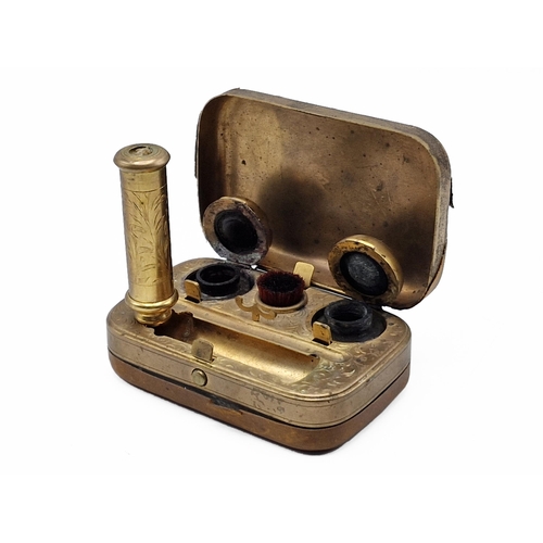 254 - Victorian leather and brass travel inkwell, interior having ornate scrolling throughout with inkwell... 