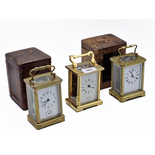 314 - Three brass cased carriage clocks, one by Bernard Freres, the other two in Morocco leather travel ca... 