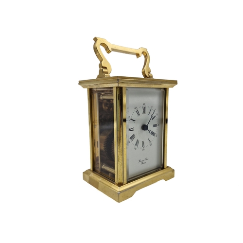 314 - Three brass cased carriage clocks, one by Bernard Freres, the other two in Morocco leather travel ca... 