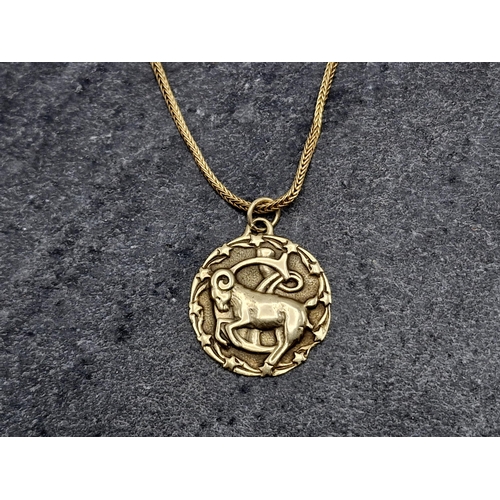 87 - 10k Aries pendant, on a long marked (indistinct) snake chain, chain 81cm, 10.7g