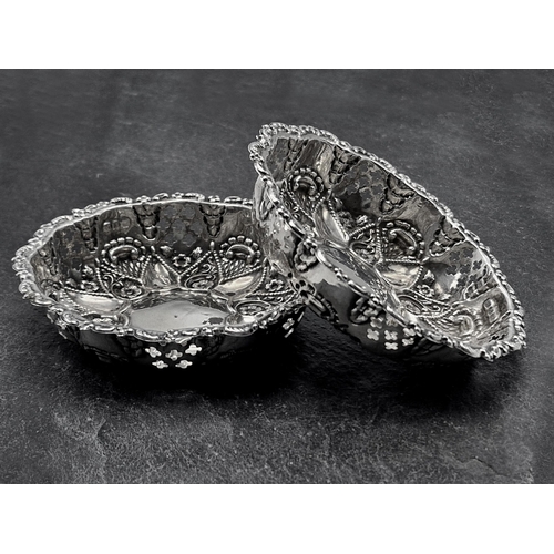 215 - Pair of repousse silver bonbon dishes, maker William Davenport, Birmingham 1897, 8cm diameter, 1.5oz