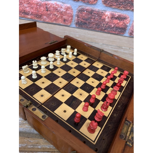 244 - Travel mahogany folding chess set with hand carved bone pieces, fully complete