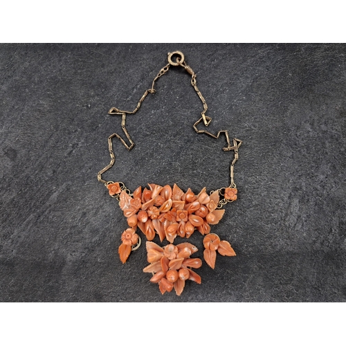 105 - Victorian 8ct rose gold and carved floral red coral statement necklace, 47cm long, 43g gross