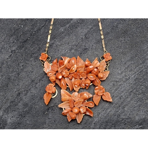 105 - Victorian 8ct rose gold and carved floral red coral statement necklace, 47cm long, 43g gross