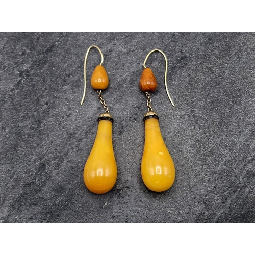 106 - Large Victorian 14ct and Egg Yolk Amber baluster drop earrings, with black enamel detail,  7.8cm lon... 