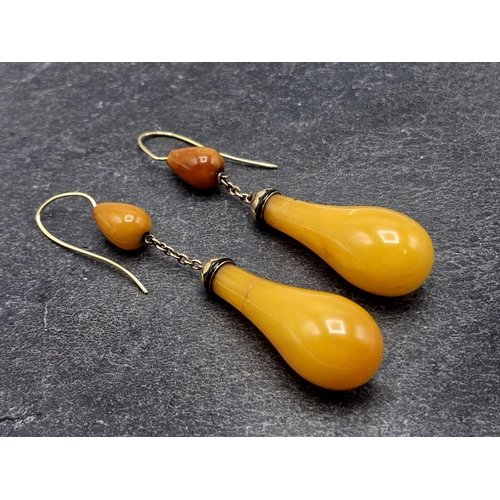 106 - Large Victorian 14ct and Egg Yolk Amber baluster drop earrings, with black enamel detail,  7.8cm lon... 