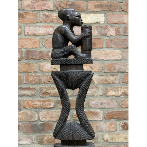 407 - African hand carved wooden ceremonial dagger, displayed on heavy black metal stand, H114cm