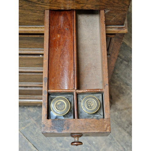 1255 - 19th century rosewood davenport fitted with leather inset hinged writing slope and an arrangement of... 