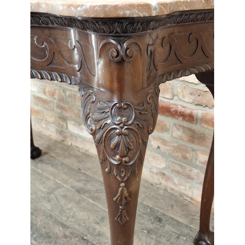 1258 - 19th century Irish mahogany serpentine console table with carved detail and marble top, raised on cl... 